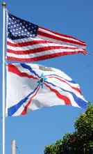 American Assyrian Flags over the blue sky of San Jose California