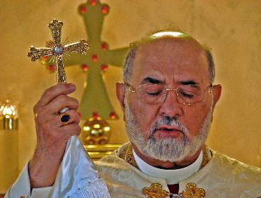 Assyrian Cross hald by Mar Dinka